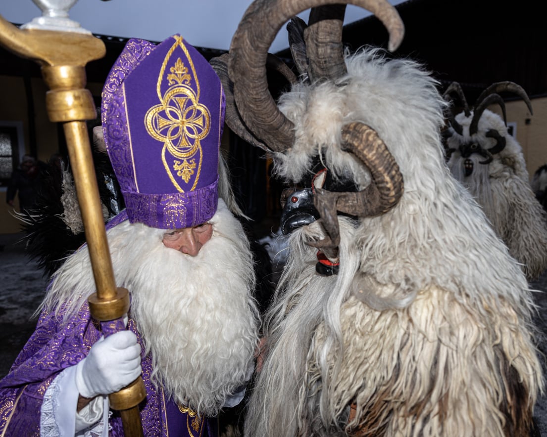 St. Nicholas and Krampus, a Christmas devil, on a traditional Christmas festive procession, Austria, Salzburg